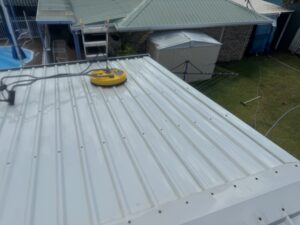 Professional roof cleaning equipment cleaning Colorbond roof in Glenella