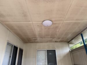 Mouldy patio ceiling before house washing in Mackay