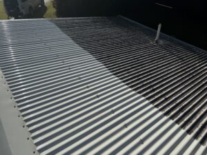 Applying roof cleaning treatment to remove mould and algae