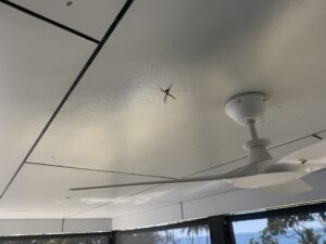 Patio ceiling cleaning and cobweb removal at a coastal Seaforth property