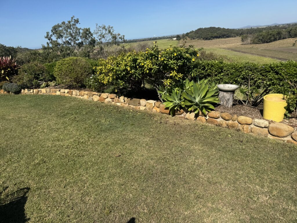 Natural colours restored to garden rocks after pressure washing