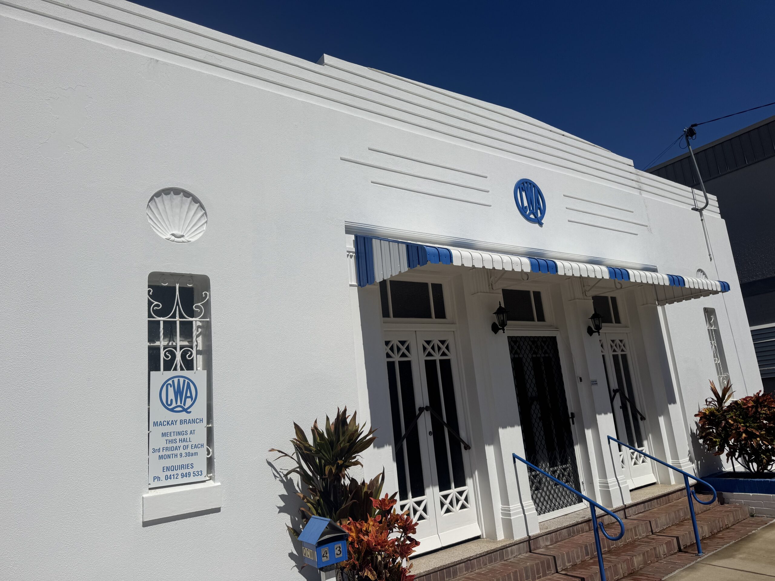 1. Clean white exterior walls and windows after commercial building washing in Mackay