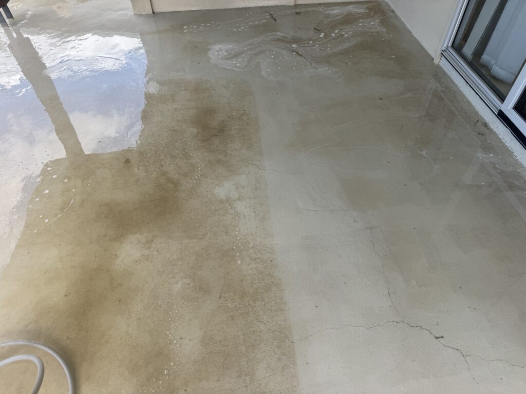 Half way pressure cleaning the back patio in Walkerston