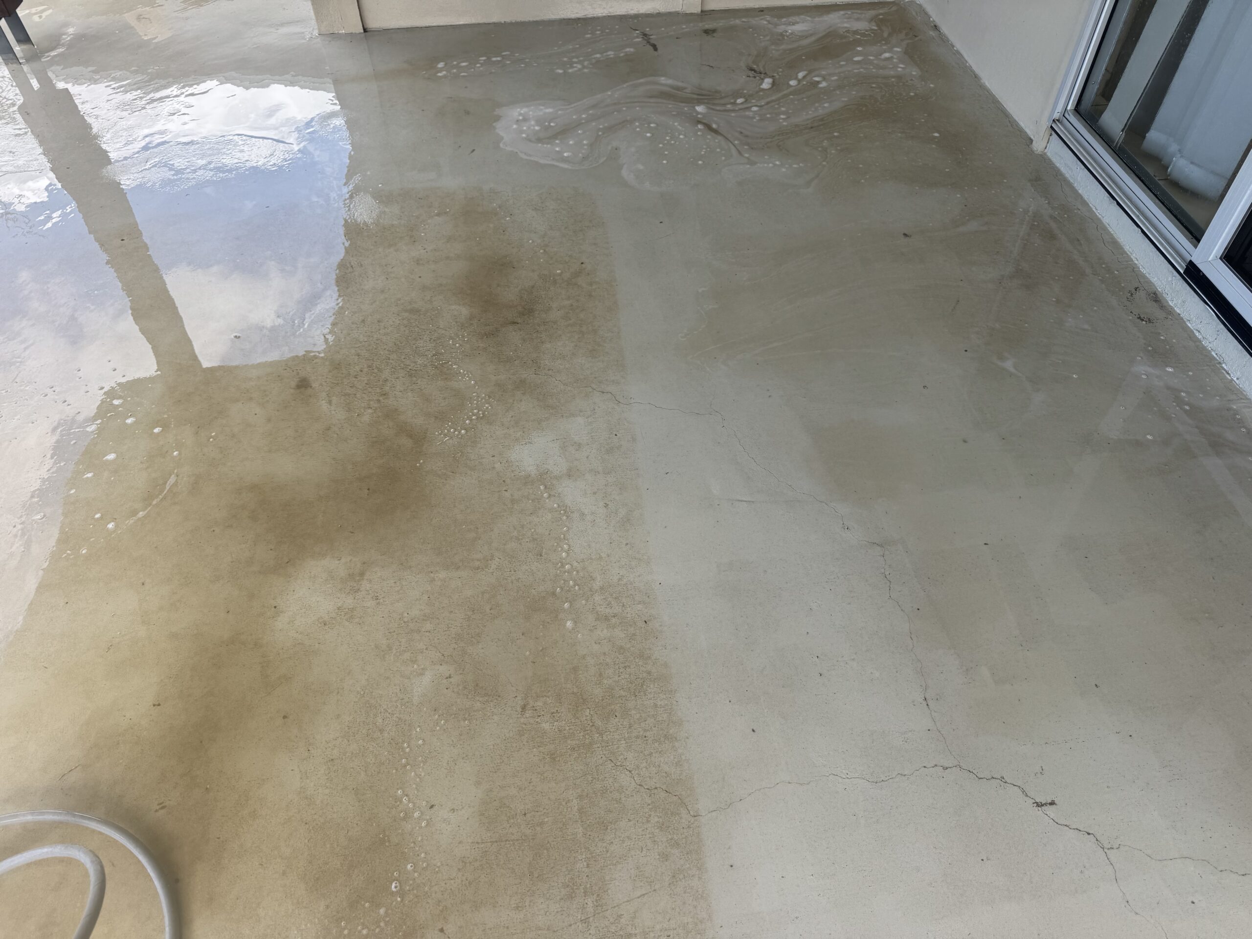 Half way pressure cleaning the back patio in Walkerston