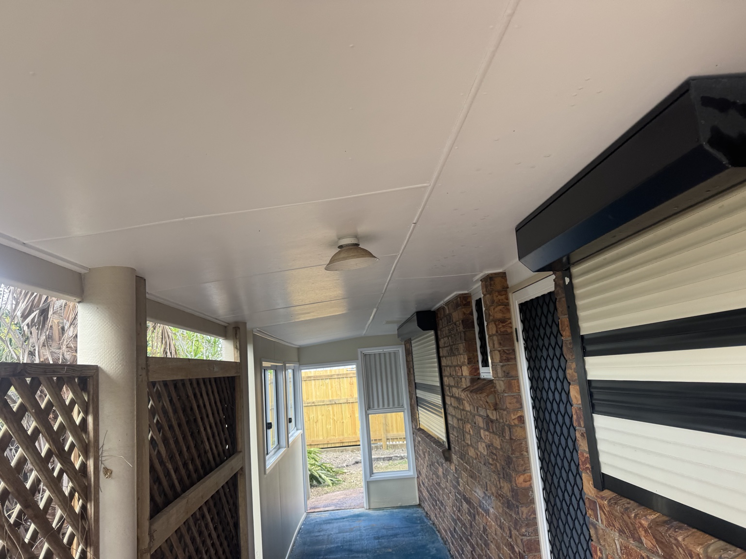 The same Sarina patio ceiling looking much cleaner after the house wash