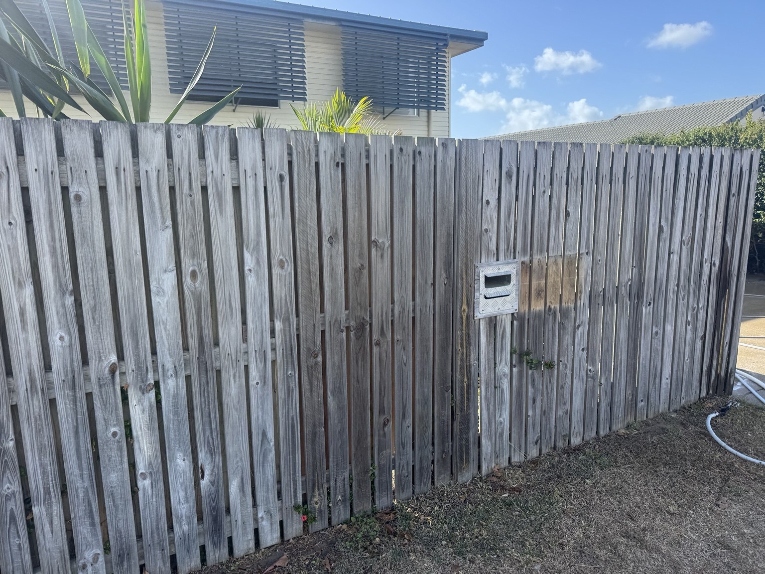 Grey weathered timber fence at a Slade Point home before cleaning